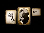 Installation view of Banksy: Genius or Vandal? in Los Angeles, 2021-2022 featuring "love is in the air" sectioned into frames.