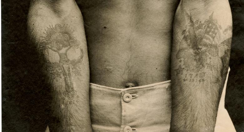 Tattooed inmate, post 1914. Charcoal print.