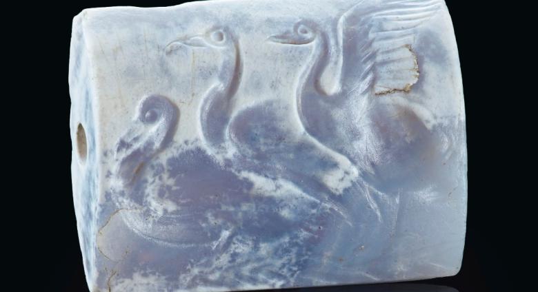 A Minoan Blue Chalcedony Tabloid Seal with Three Swans Late Palace Period, circa 16th century B.C.