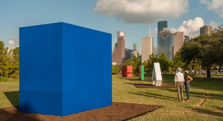 large colorful Carmen Herrera sculptures in a city park