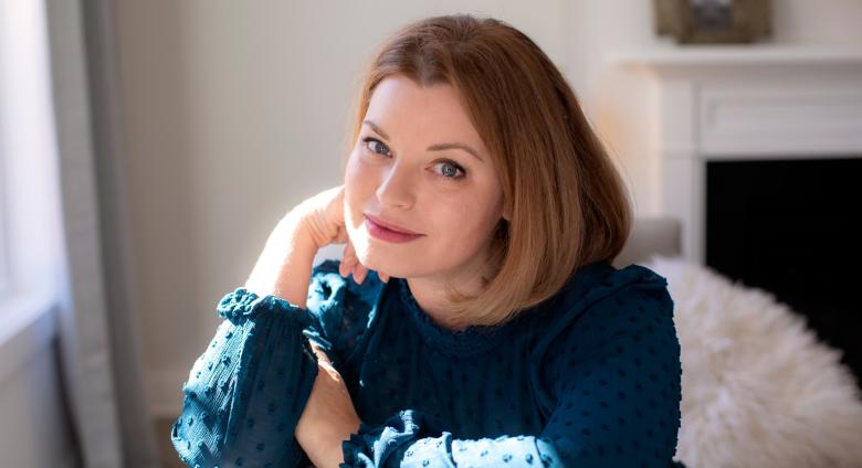 photo of Jennifer Dasal, a white woman wearing a navy top with strawberry blonde hair