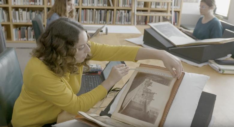 cataloguers at work on photography