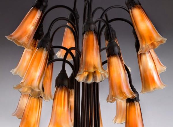 Tiffany Glass & Decorating Company, Eighteen-light Lily Table Lamp, prior to 1902, bronze, blown glass.