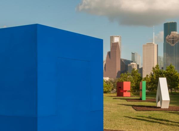 large colorful Carmen Herrera sculptures in a city park