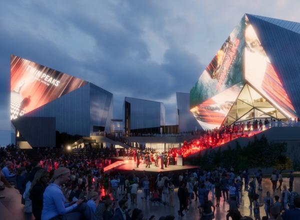 People attending an event held in the square in front of the European Film Centre CAMERIMAGE building, 2022. License