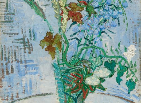 Van Gogh still life of flowers in a glass vase on a table top with a blue cross-hatched wall behind